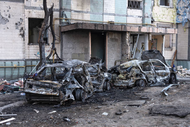 A charred room with a shattered window and door, representing the impact of fire damage and the restoration process.