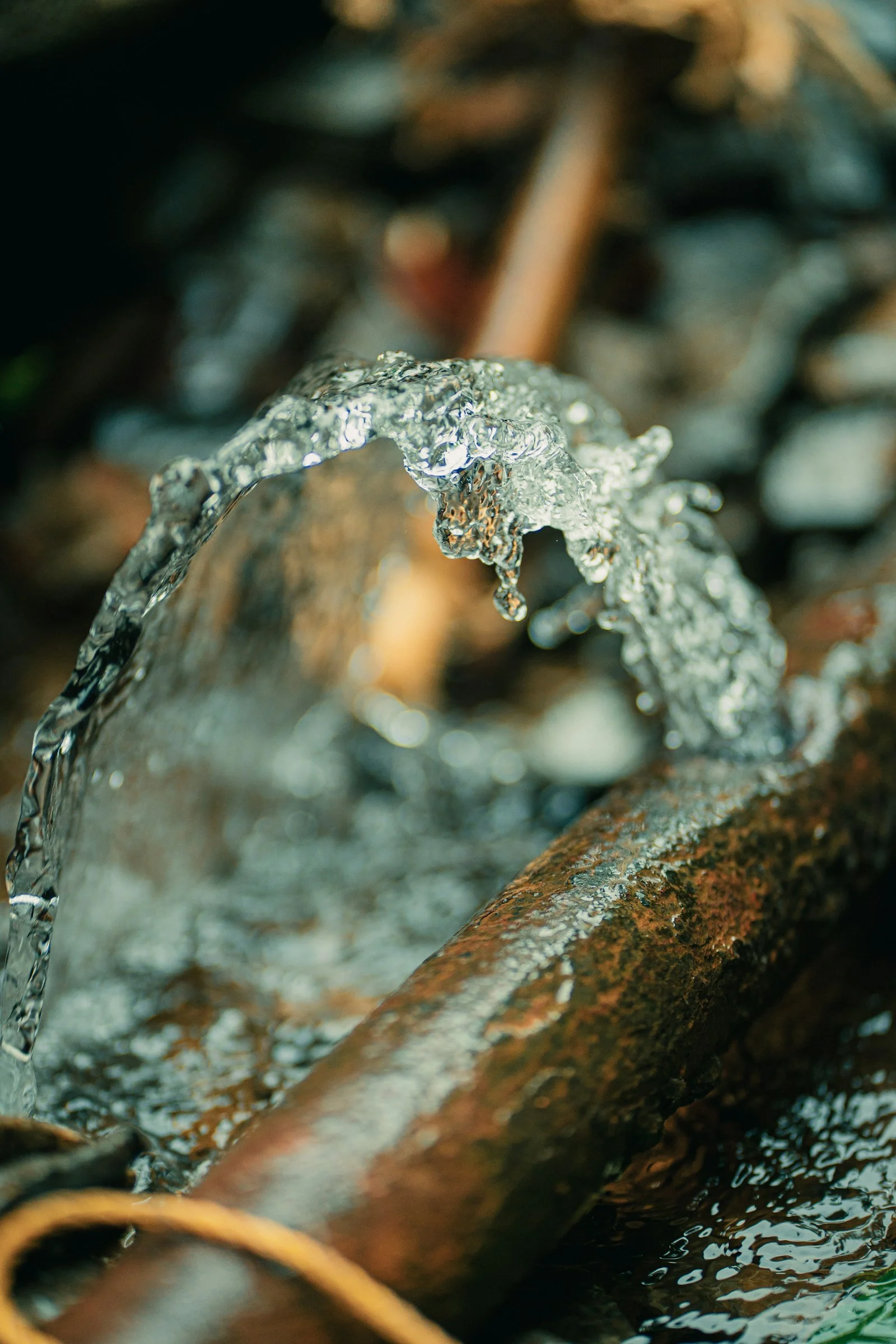 Water spraying from a burst pipe